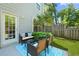 Relaxing back patio with stylish furniture and landscaped surroundings at 849 Bibury Ct, Charleston, SC 29414