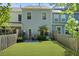 Backyard featuring a well-maintained lawn and wood fence at 849 Bibury Ct, Charleston, SC 29414