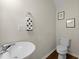 Cozy half-bathroom features a modern sink and toilet, perfect for guests at 849 Bibury Ct, Charleston, SC 29414