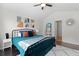 Well-lit bedroom features modern art, a cozy rug, and a ceiling fan at 849 Bibury Ct, Charleston, SC 29414
