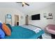 Bright bedroom with ceiling fan, large TV, and comfortable seating at 849 Bibury Ct, Charleston, SC 29414