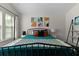 Spacious bedroom showcasing bright artwork, a cozy bed, and natural light at 849 Bibury Ct, Charleston, SC 29414