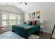 Stylish bedroom with vaulted ceiling, modern art, large windows, and plush rug at 849 Bibury Ct, Charleston, SC 29414