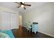 Cozy bedroom with desk, chair, ceiling fan, and closet at 849 Bibury Ct, Charleston, SC 29414