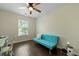 Versatile bedroom featuring a futon, desk, and wood floors at 849 Bibury Ct, Charleston, SC 29414