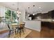 Dining area with a view into the kitchen, perfect for entertaining and everyday living at 849 Bibury Ct, Charleston, SC 29414