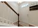 Welcoming foyer with stairs, hardwood floors, and coat rack by the front door at 849 Bibury Ct, Charleston, SC 29414