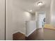 Bright hallway features hardwood floors and leads to rooms with ample natural light at 849 Bibury Ct, Charleston, SC 29414