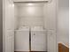 Convenient laundry room featuring a full-size washer and dryer at 849 Bibury Ct, Charleston, SC 29414