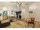 Open-concept living room with hardwood floors, views to the kitchen and dining area, and ample natural light at 849 Bibury Ct, Charleston, SC 29414