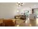 Bright living room with hardwood floors, ample seating, and a view to the dining area at 849 Bibury Ct, Charleston, SC 29414