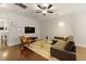 Cozy living room featuring hardwood floors, a ceiling fan, and a comfortable seating arrangement at 849 Bibury Ct, Charleston, SC 29414