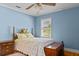 Bright bedroom features blue walls, hardwood floors, and a double bed at 9995 Lodge Hwy, Lodge, SC 29082