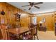 Cozy dining area with wood-paneled walls, vintage-style table and chairs, and ample storage at 9995 Lodge Hwy, Lodge, SC 29082