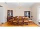 Elegant dining room with a large table, chandelier, and classic wood furniture and floors at 9995 Lodge Hwy, Lodge, SC 29082