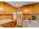 Vintage-style kitchen with light wood cabinets, classic appliances, and retro-style sink at 9995 Lodge Hwy, Lodge, SC 29082