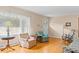 Bright living room with hardwood floors, cozy seating, and natural light from large window at 9995 Lodge Hwy, Lodge, SC 29082