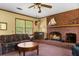Comfortable living room features a red brick fireplace and a classic style at 9995 Lodge Hwy, Lodge, SC 29082
