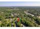 Expansive aerial view of a residential area with lush greenery, featuring a pinpoint marker on a property at 103 Sylvan Ter, Summerville, SC 29485