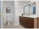 Modern bathroom vanity featuring wood cabinets, white countertop, black faucet, and large mirror at 103 Sylvan Ter, Summerville, SC 29485