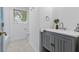 Bright bathroom with modern vanity, brushed gold fixtures, window, and decor at 103 Sylvan Ter, Summerville, SC 29485