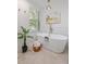 Bright bathroom features soaking tub, elegant lighting, hardwood floors, and stylish accents at 103 Sylvan Ter, Summerville, SC 29485