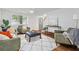 Inviting living room features hardwood floors, ample natural light, and a cozy seating area at 103 Sylvan Ter, Summerville, SC 29485