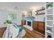 Bright living space with decorative fireplace, floating shelves, and elegant furniture at 103 Sylvan Ter, Summerville, SC 29485
