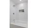 Clean white shower with tiled niche and modern fixtures at 103 Sylvan Ter, Summerville, SC 29485