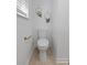 Simple powder room with toilet, neutral walls, and decor at 103 Sylvan Ter, Summerville, SC 29485