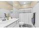 Bathroom features a white vanity, a toilet and shower with white tiles at 1069 Blockade Runner Pkwy, Summerville, SC 29485