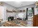 Bedroom featuring a toddler bed, wood floors, a window and a play carpet at 1069 Blockade Runner Pkwy, Summerville, SC 29485