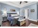 The primary bedroom is staged with a queen bed, trey ceilings, and dual nightstands at 1069 Blockade Runner Pkwy, Summerville, SC 29485