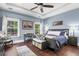 A primary bedroom featuring hardwood floors, trey ceilings, and natural light from two windows at 1069 Blockade Runner Pkwy, Summerville, SC 29485