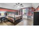 Bedroom featuring two-tone walls, built-in bookshelves, and a bed with gray bedding at 1069 Blockade Runner Pkwy, Summerville, SC 29485