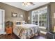 Bedroom features a bed, a window view, and dark stained wood floors at 1069 Blockade Runner Pkwy, Summerville, SC 29485