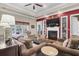 Inviting living room featuring a fireplace, hardwood floors, and comfortable seating at 1069 Blockade Runner Pkwy, Summerville, SC 29485