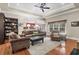 Comfortable living room featuring hardwood floors, tray ceiling, and cozy seating at 1069 Blockade Runner Pkwy, Summerville, SC 29485