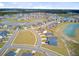 Aerial view of a neighborhood featuring many homes and community lakes at 107 Pescaro Ln, Summerville, SC 29486