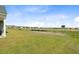 Expansive backyard with lush green grass, offering a serene and spacious outdoor living area with beautiful neighborhood views at 107 Pescaro Ln, Summerville, SC 29486