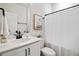 Bright bathroom features a white vanity with sleek black hardware and a shower with a charming penguin art at 107 Pescaro Ln, Summerville, SC 29486