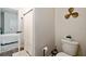 Cozy bathroom with a toilet, decorative propellor, and doorway leading to the bedroom at 107 Pescaro Ln, Summerville, SC 29486