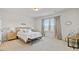 Bright bedroom with neutral tones and a comfortable bed, perfect for relaxation at 107 Pescaro Ln, Summerville, SC 29486