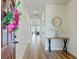 Inviting home foyer with wood-look flooring, a console table, and decorative accents at 107 Pescaro Ln, Summerville, SC 29486