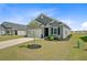 Well-manicured front yard and neutral siding home at 107 Pescaro Ln, Summerville, SC 29486