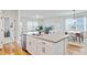 Open floor plan flows from the kitchen island into the living, dining area for seamless entertaining at 107 Pescaro Ln, Summerville, SC 29486