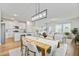 Open-concept living space features a dining area, modern kitchen, and inviting living room with plenty of natural light at 107 Pescaro Ln, Summerville, SC 29486