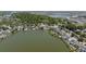 Scenic aerial view of waterfront homes along a lake with lush landscapes, providing privacy and charm at 1087 Clearspring Dr, Charleston, SC 29412