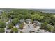 Stunning aerial view of a neighborhood showcasing well-maintained homes, mature trees, and a cul-de-sac at 1087 Clearspring Dr, Charleston, SC 29412