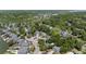 Aerial view of a neighborhood surrounded by mature trees and water, showcasing community layout and greenery at 1087 Clearspring Dr, Charleston, SC 29412